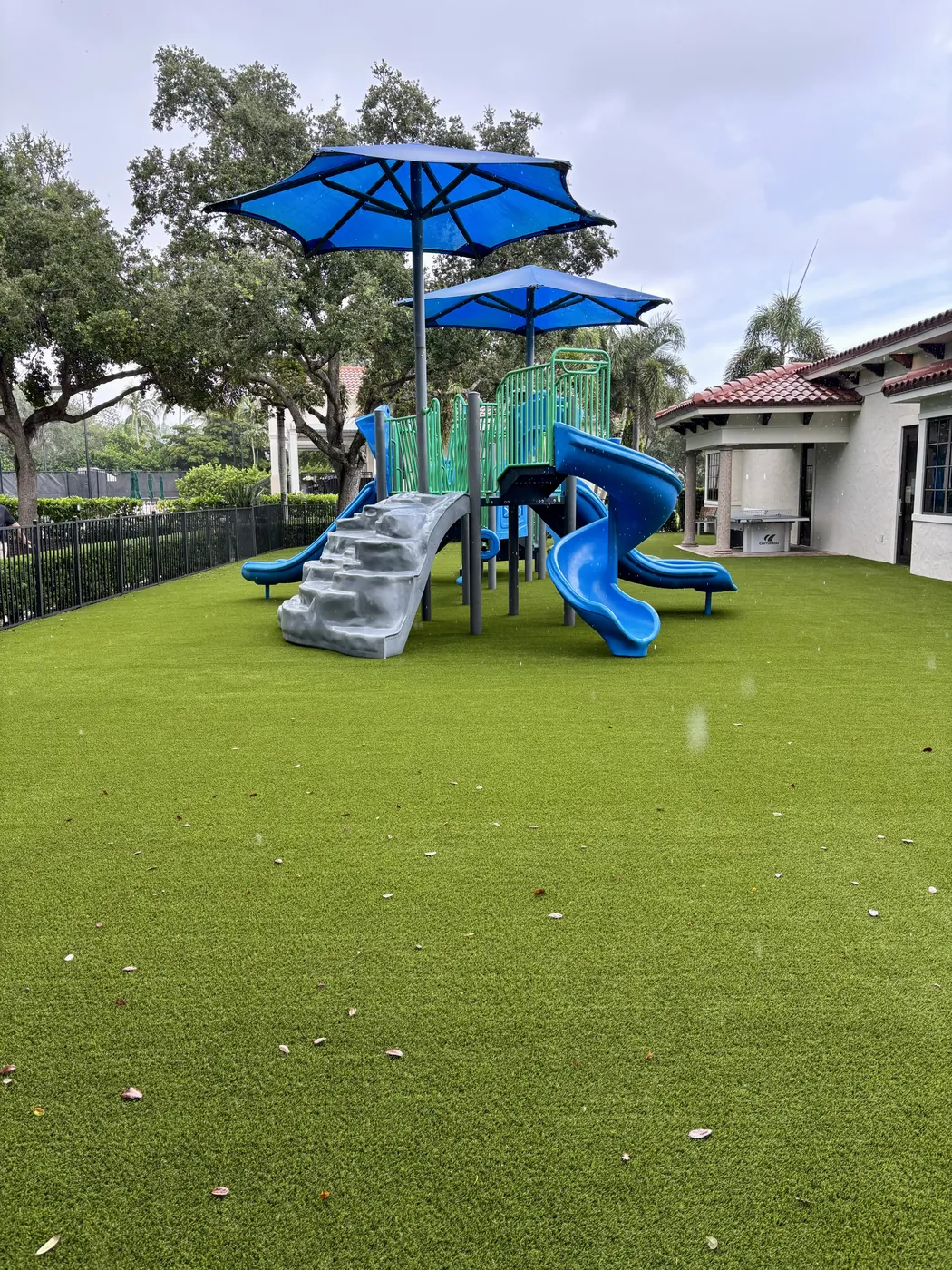Playground with synthetic turf surfacing